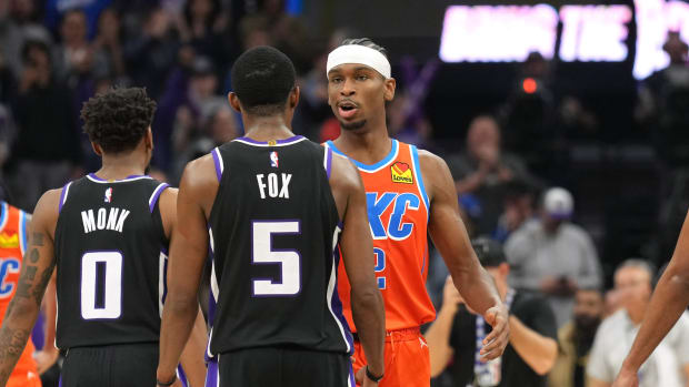 Dec 14, 2023; Sacramento, California, USA; Oklahoma City Thunder guard Shai Gilgeous-Alexander (2) greets Sacramento Kings guard De'Aaron Fox (5) after the game at Golden 1 Center. Mandatory Credit: Darren Yamashita-USA TODAY Sports  